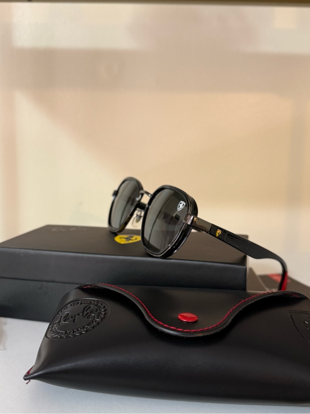 Ray-Ban Black Round Sunglasses with Ferrari Temple Accent